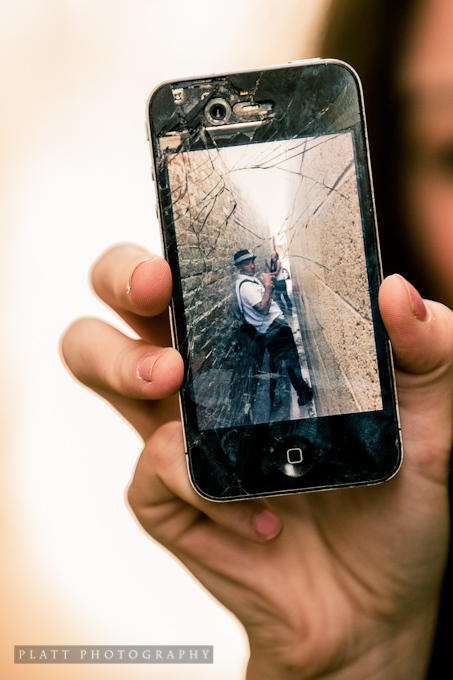 Photo of a cracked iPhone screen, taken at a senior portrait session in Scottsdale Arizona