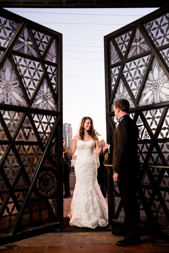 Bride and groom portrait at the door of the Trinity Episcopal Cathedral in Phoenix Arizona