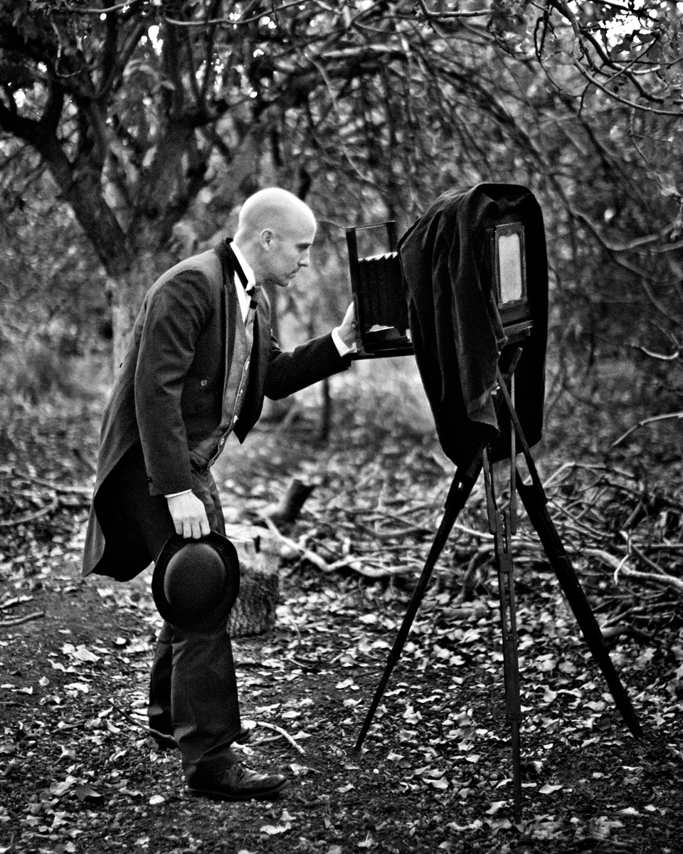 Jared Platt, portrait photographer, with a large format camera dressed in 1800s cloathing