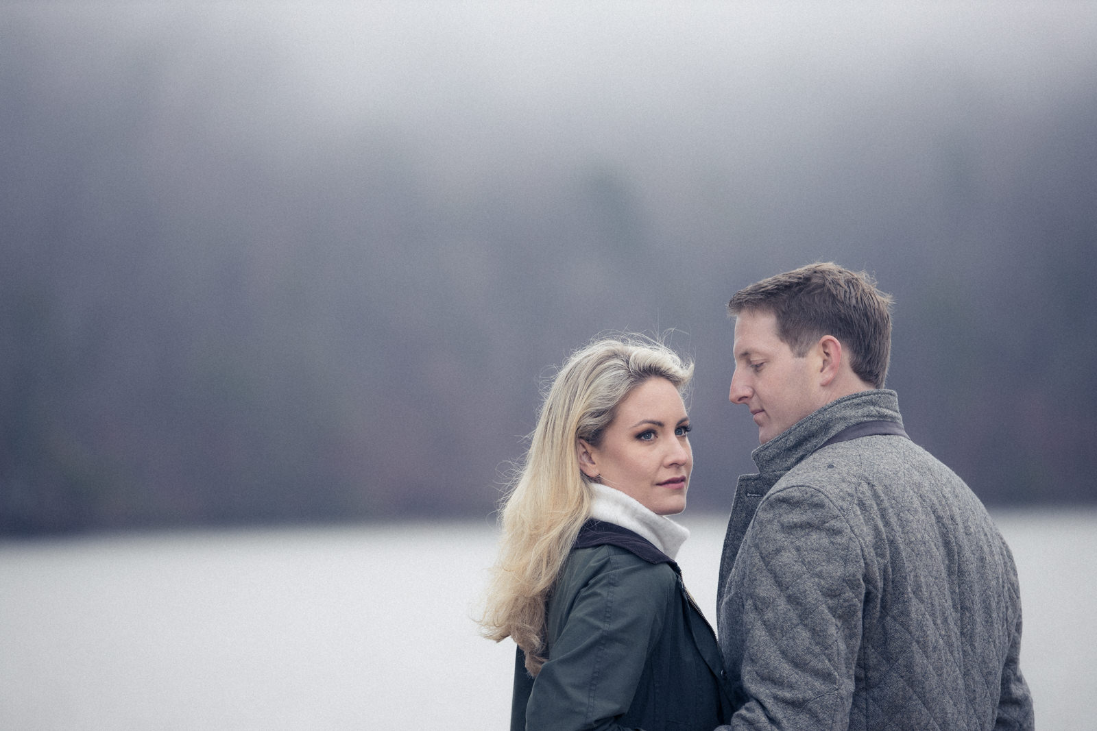 Engagement portraits in Atlanta Georgia near the lake close up with fog rolling in